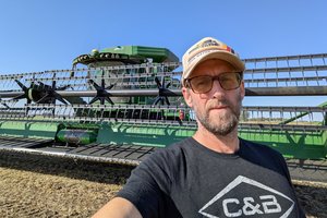 Me standing in front of the combine